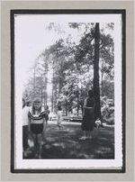 Photograph of elementary school students playing in field while an adult woman observes, Clarkesville, Habersham County, Georgia, 1950