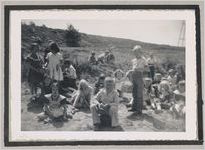 Photograph of a group of children seated in the middle of a field, Clarkesville, Habersham County, Georgia, 1950