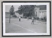 Photograph of two boys playing a game, possibly volleyball, Clarkesville, Habersham County, Georgia, 1950