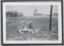 Photograph of four boys reading outdoors, Clarkesville, Habersham County, Georgia, 1950