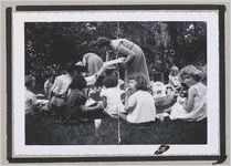 Photograph of a group of children eating while seated outdoors,  Clarkesville, Habersham County, Georgia, 1950