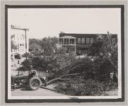 Photograph of men using a tractor to clear trees from the downtown area, Clarkesville, Habersham County, Georgia, 1950