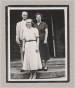 Photograph of three people standing on the front steps of a building, Clarkesville, Habersham County, Georgia, 1950