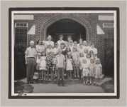 Photograph of people posed for a group portrait on the front steps of a building, Clarkesville, Habersham County, Georgia, 1950