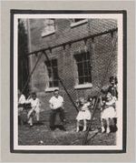 Photograph of children playing on a swingset, Clarkesville, Habersham County, Georgia, 1950