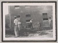 Photograph of men working near landscaping and construction materials, Clarkesville, Habersham County, Georgia, 1950
