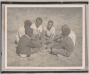 Photograph of a group of African American boys seated in a circle, Clarkesville, Habersham County, Georgia, 1950