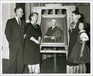 Gathering around the Portrait of Roland B. Daniel