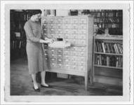 Photograph of a librarian using a card catalog, Lafayette, Georgia