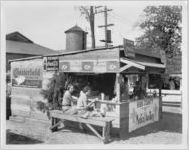 Photograph of the Bibb County Medical Auxiliary food booth at the Georgia State Fair, Macon, Bibb County, Georgia, 1928