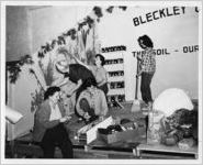 Photograph of women preparing the Bleckley County exhibit at the Georgia State Fair, Macon, Bibb County, Georgia, 1943
