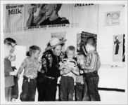 Photograph of the Cisco Kid with a group of boys at the Georgia State Fair, Macon, Bibb County, Georgia 1951
