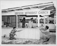 Photograph of workers building a food stand for the Southside Methodist Church at the Georgia State Fair, Macon, Bibb County, Georgia, 1953