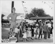 Photograph of people waiting in line to enter the Georgia State Fair, Macon, Bibb County, Georgia, 1956