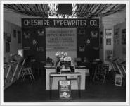 Photograph of the Cheshire Typewriter Company exhibit at the Georgia State Fair, Macon, Bibb County, Georgia, 1958