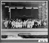 [Photograph of people sitting on the stage of Pierce Chapel, Macon, Bibb County, Georgia, ca. 1900-1939?]