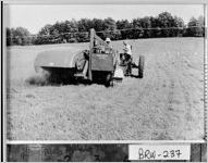 [Photograph of Joe Harvell and Marvin Maddox harvesting crimson clover seed, Barrow County, Georgia, ca. 1950-1969]