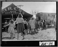 [Photograph of children and adults lining up to gain admission to the Hoxie Brother Circus, Waynesboro, Burke County, Georgia, ca. 1968]