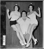 [Photograph of man holding two women in his arms, Moultrie, Colquitt County, Georgia, ca. 1950-1963?]