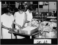 [Photograph of three women preparing sandwiches, Douglas, Coffee County, Georgia, ca. 1960-1963?]