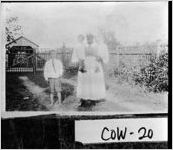 [Photograph of children with their African-American nurse, Newnan, Coweta County, Georgia, ca. 1920]