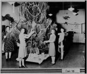[Photograph of women trimming a Christmas tree, Newnan, Coweta County, Georgia, 1937]
