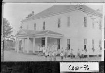 [Photograph of students posing for photograph in front of the school, Haralson, Troup County, Georgia, between 1920 and 1939]