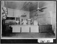 [Photograph of the interior of a store with a butcher behind a counter, Moreland, Coweta County, Georgia, ca. 1920?]