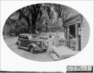 [Photograph of woman making a purchase at Hall's Wayside Market, Chatham County, Georgia, ca. 1940]