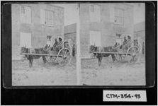 [Stereograph of two African-Americans in an oxcart on a city street, Savannah, Chatham County, Georgia, ca. 1873]