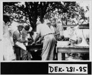 [Photograph of Frank Powers cooking barbecue, Lithonia, DeKalb County, Georgia, 195-]