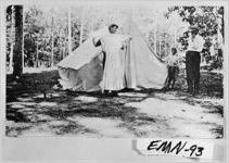 [Photograph of young man at McKinney's Pond pretending to model a dress, Emanuel County, Georgia, not after 1914]