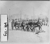 [Stereograph of men resting on bench, Cotton States Exposition in background, Atlanta, Fulton County, Georgia, 1895]