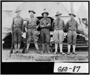 [Postcard of uniformed World War I soldiers in front of tent at army camp, Georgia, ca. 1917]