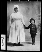 [Photograph of unidentified African-American nurse holding the hand of Earl or Lorraine Culbreath, Georgia, 1910-1930]