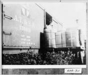 [Photograph of men loading chenille products onto a train, Calhoun, Gordon County, Georgia, 1944]