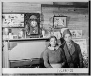 [Photograph of two African-Americans sitting in their home, Greene County, Georgia, 1941 Nov.]