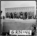 [Photograph of a large building with a group of people standing in front of it, White Plains, Greene County, Georgia, between 1900 and 1920]