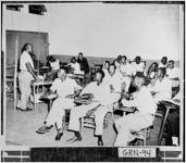 [Photograph of a group of African-Americans gathered in a classroom, Greensboro, Greene County, Georgia, 1950 or 1951]