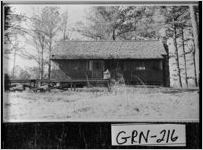 [Photograph of the exterior of a hunting and fishing lodge, Greene County, Georgia, 1939 Feb.]