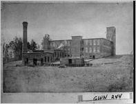 [Photograph of the exterior of a cotton mill, Lawrenceville, Gwinnett County, Georgia, 192-]