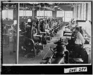 [Photograph of employees behind machines in the GENESCO factory, Lawrenceville, Gwinnett County, Georgia, 1948]