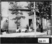 [Photograph of people and goats outside of house, Georgia]