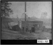 [Photograph of men standing near a railroad working station, Hall County, Georgia, ca. 1925]