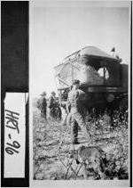 [Photograph of several men observing a McCormick-Deering cotton picker at work, Hart County, Georgia, ca. 1950]