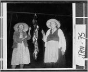 [Photograph of Mrs. Gertrude Meeks and Mrs. Dessie Powell showing off catch, Johnson County, Georgia, 1966 May ]