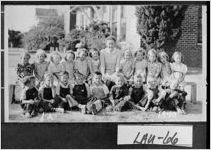 [Postcard of Miss Grace Bush with first grade students at Rentz School, Rentz, Laurens County, Georgia, 1940]