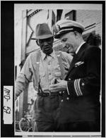 [Photograph of Rear Admiral Richard E. Hawes and friend on Jackson Street, Thomson, McDuffie County, Georgia, ca. 1946]