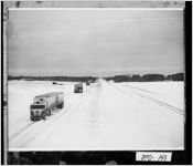 [Photograph of trucks stalled on Interstate 20 during a snowstorm, McDuffie County, Georgia, 1973 Mar. 15]