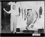 [Photograph of E.C. Pate with fish, Pine Harbor, McIntosh County, Georgia, 1949]